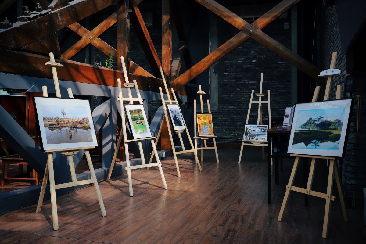 Easels displaying artwork in an attic.
