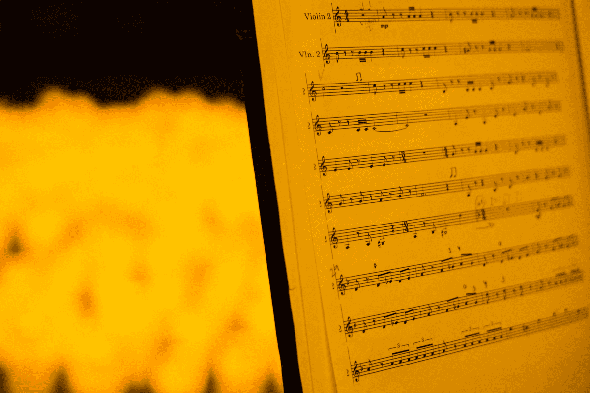 A music sheet by candlelight.