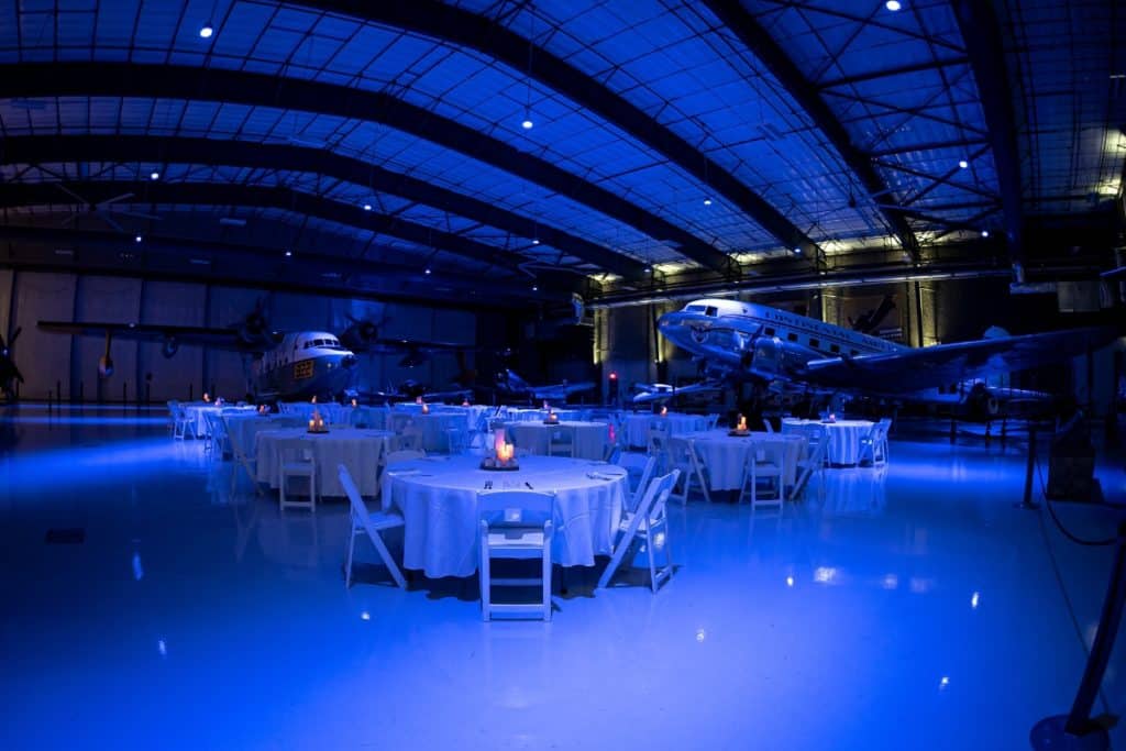 Dining tables are set up in a flight museum