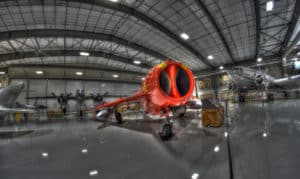 A red plane in a hangar