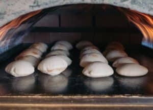 Breads baking in the oven at Aladdin Mediterranean Cuisine in Houston