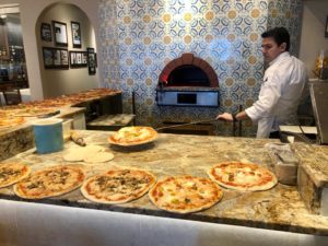 Loading the pizza oven at Amalfi in Houston