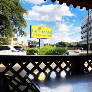 View of the sign from the patio at  La Fendee Mediterranean Grill in Houston