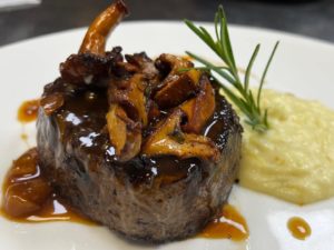 Glazed steak with mushrooms and mashed potatoes at Café Rabelais.