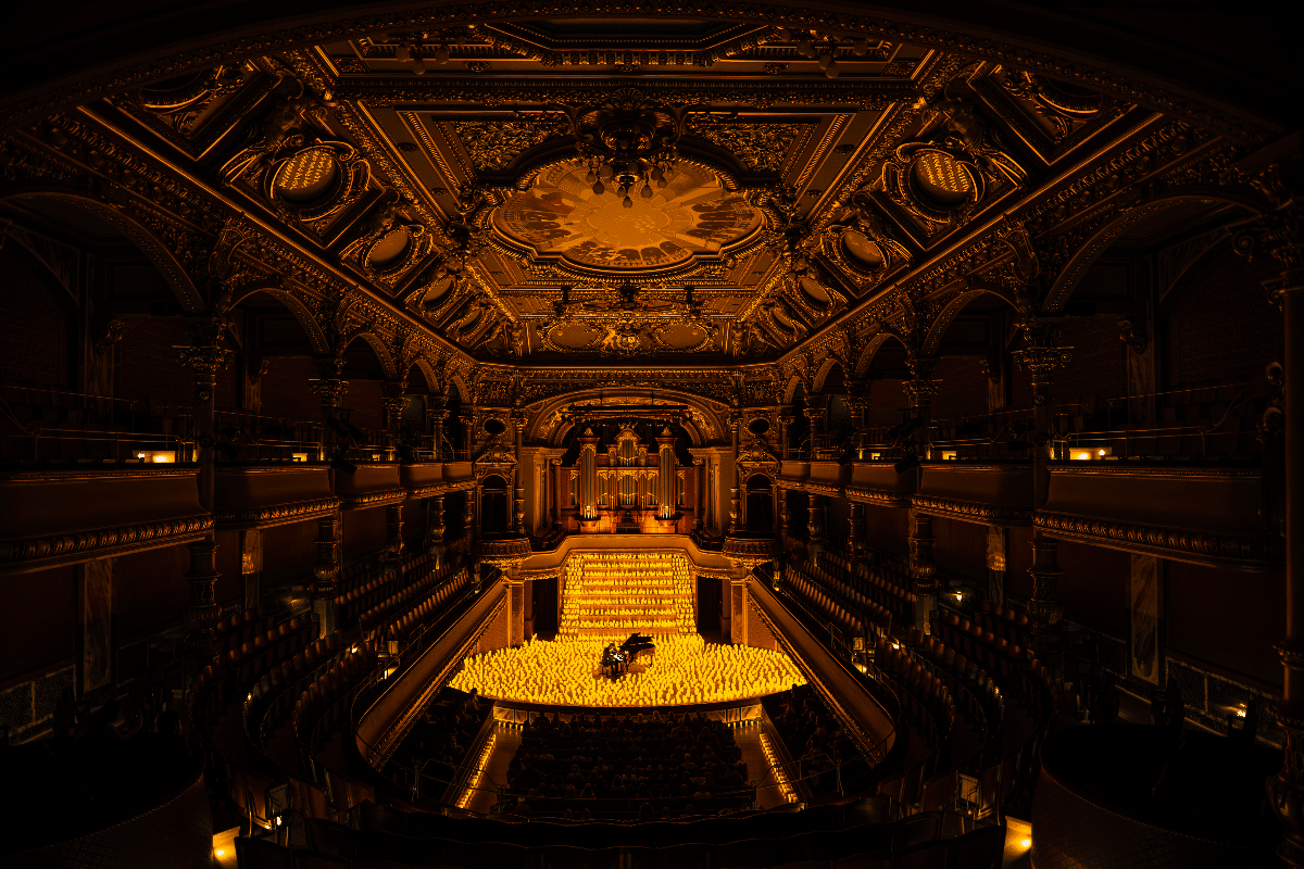 A solo pianist performing by candlelight at Victoria Hall